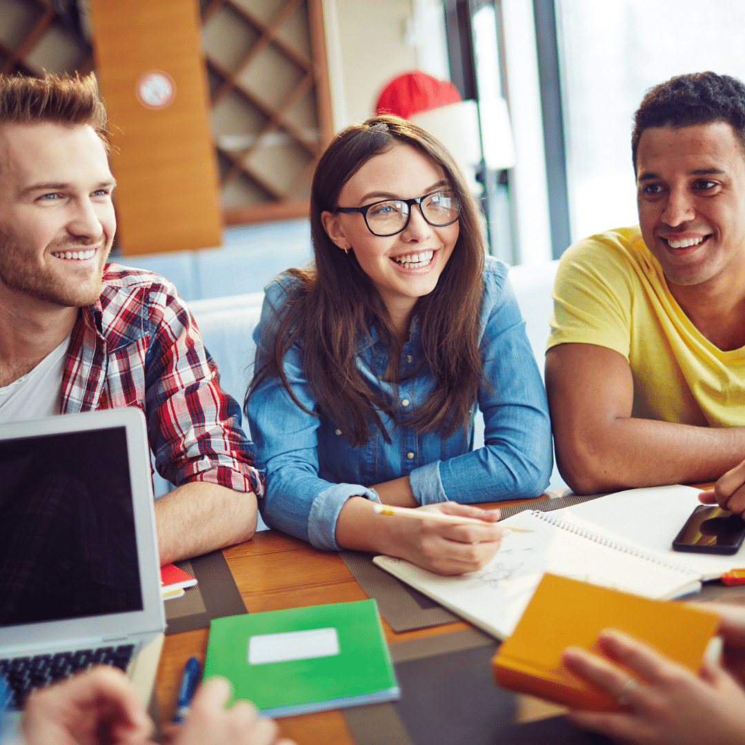 happy students around a table using our free leaving cert german notes